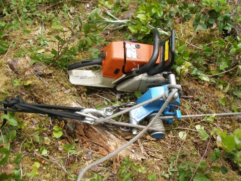 This small chain saw head attached to a capstan winch. We used a 500 foot long length of 3/8 nylon rope to pull the pipe up the hill.